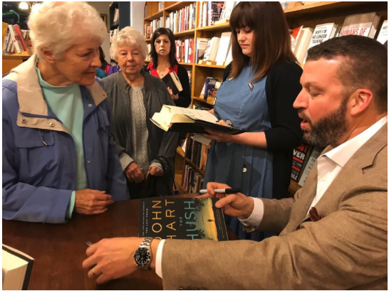 John Hart signs his bestseller The Hush for South Main Book Company fans.